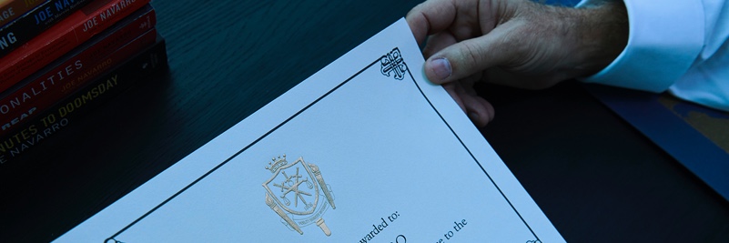 Man holding certificate in his hand